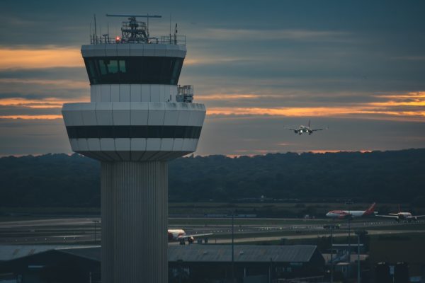 Air traffic control tower beside an airport runway