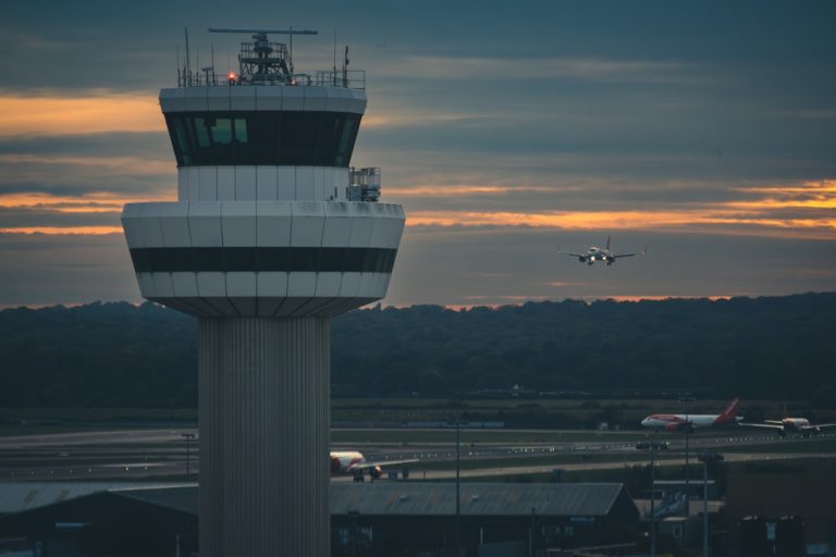 Air traffic control tower beside an airport runway