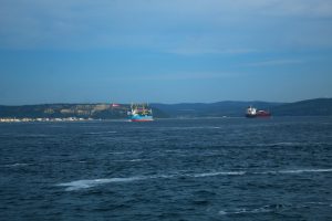 Two commercial ships crossing open water, used as an illustrative image for Strait of Hormuz shipping