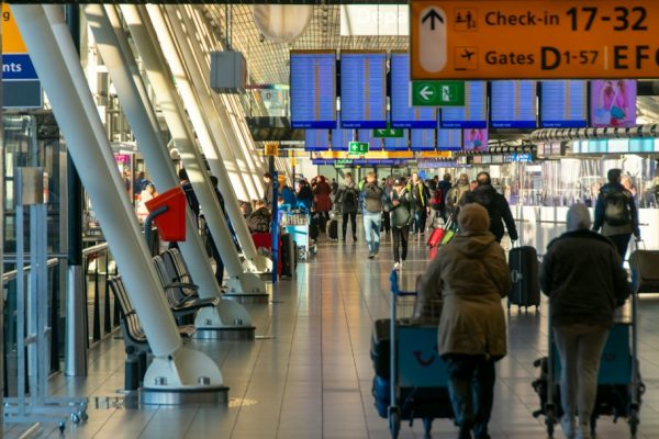 Travelers inside an airport terminal, used as an illustrative image for flight disruptions at Riyadh airport