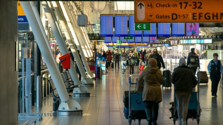 Travelers inside an airport terminal, used as an illustrative image for flight disruptions at Riyadh airport