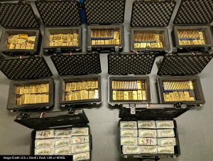 Cash and gold bars recovered by the FBI during a search of David J. Rush's residence, according to the U.S. Attorney's Office for the Eastern District of Virginia.