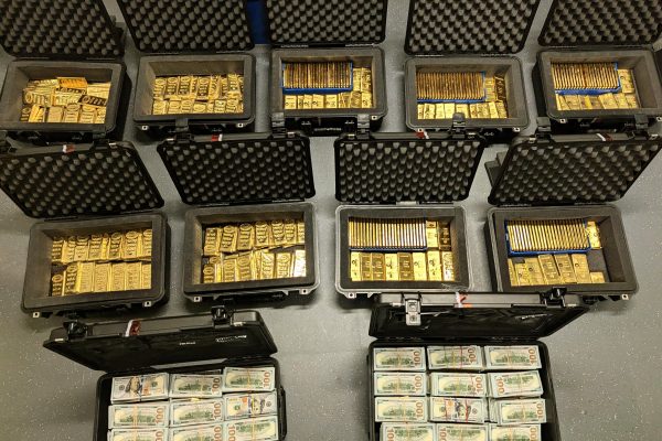 Cash and gold bars recovered by the FBI during a search of David J. Rush's residence, according to the U.S. Attorney's Office for the Eastern District of Virginia.