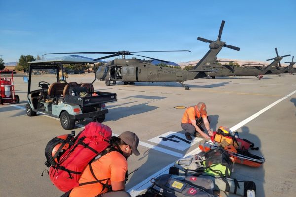 Idaho Army National Guard Black Hawk and rescue personnel preparing equipment during the Purjue Canyon rescue response.