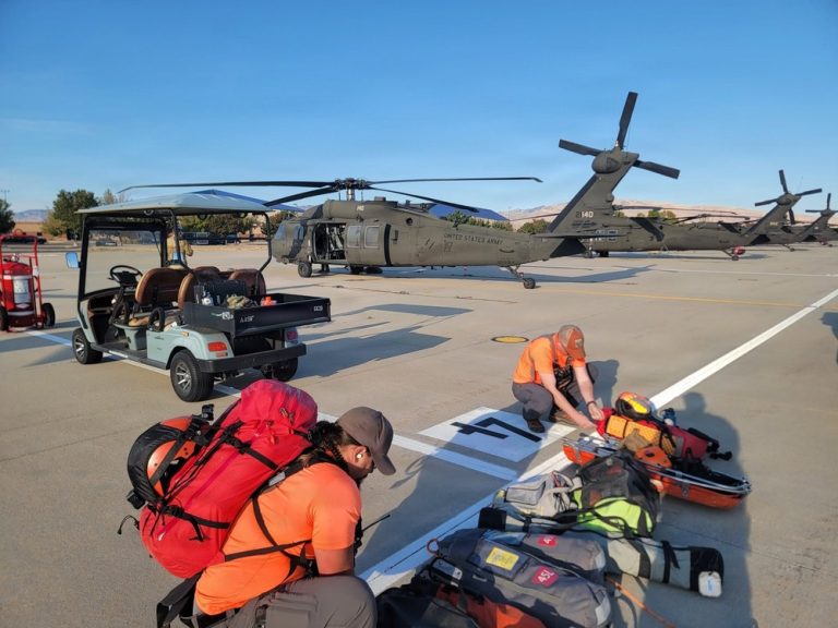 Idaho Army National Guard Black Hawk and rescue personnel preparing equipment during the Purjue Canyon rescue response.