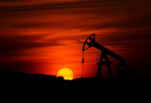 Oil pump jack at sunset, a contextual image for rising crude oil prices. Photo by Zbynek Burival on Unsplash.