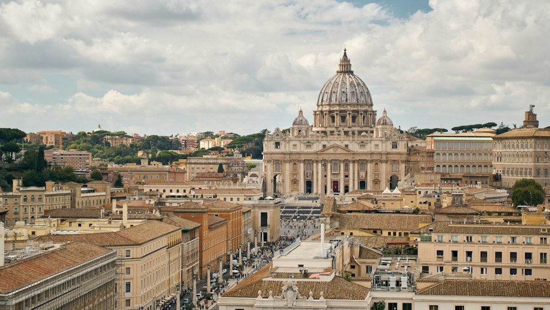 St. Peter's Basilica in Vatican City beneath a cloudy sky
