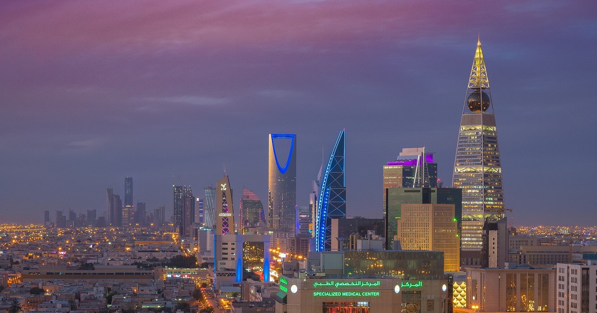 The Riyadh skyline at dusk, showing the Kingdom Centre and Al Faisaliah towers