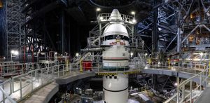 The completed left Artemis III booster with its nose cone installed in the Vehicle Assembly Building