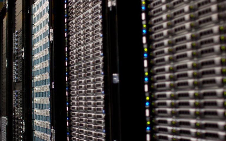 Rows of Wikimedia Foundation server racks in a data center.