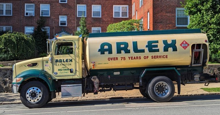 A heating oil delivery truck parked on a residential street in Massachusetts