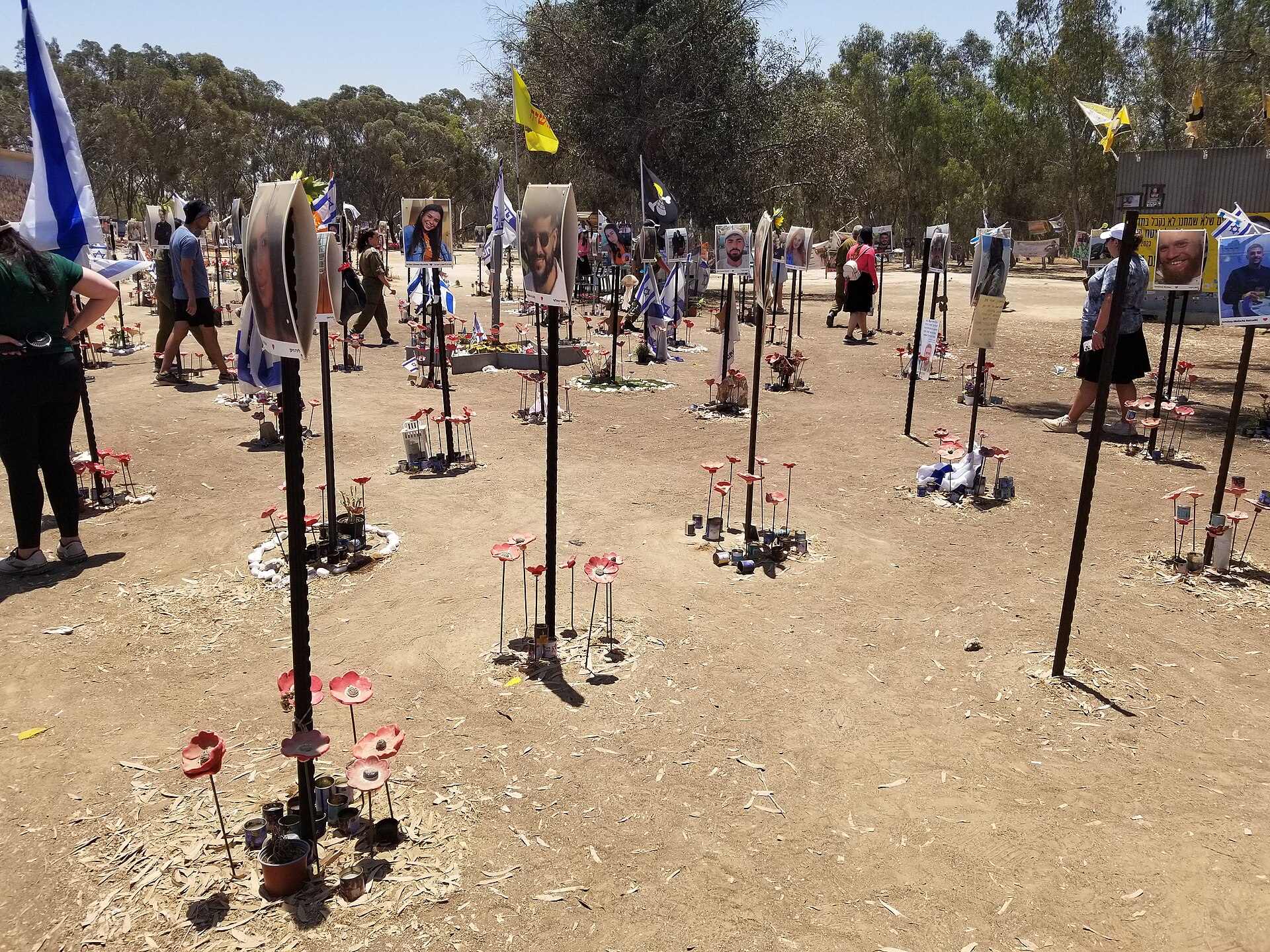 Memorial at the Nova music festival site in Re'im, Israel, with photos of victims