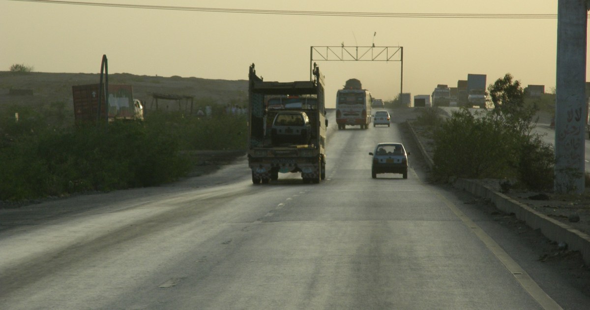 File photo: a passenger bus and other traffic on the Indus Highway near Hyderabad, Pakistan